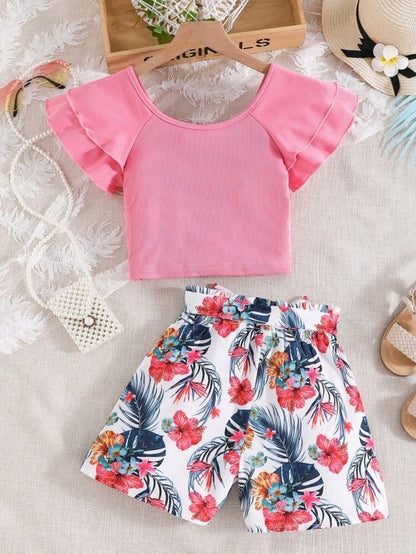 Pink blouse and flowered shorts