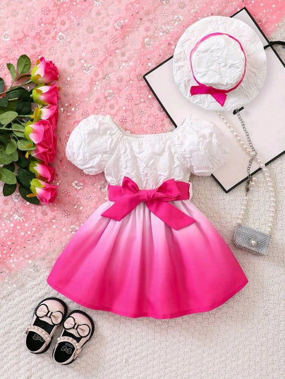 Vestido rosado con blanco con sombrero